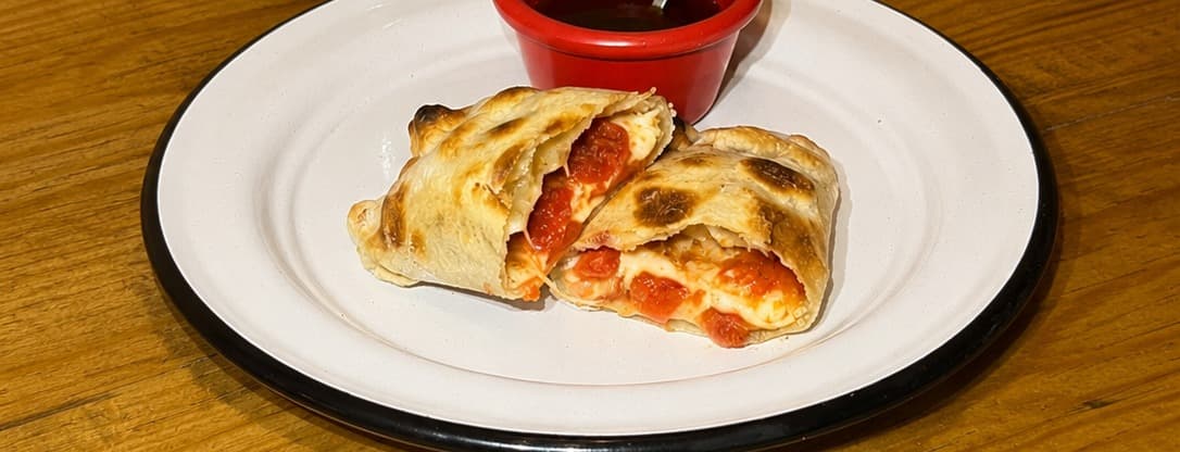Pepperoni pizza empanada