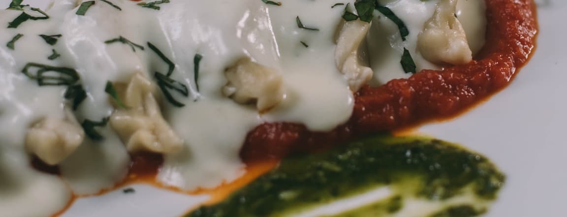 Potato and pecorino culurgiones (ravioli) with tomate sauce pesto