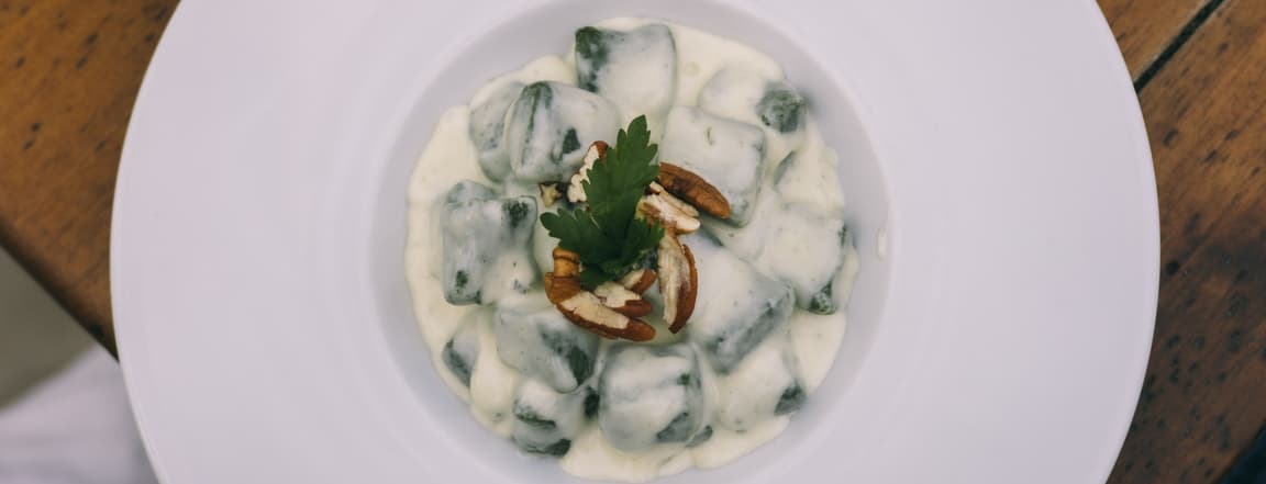 Spinach gnocchi with gorgonzola cheese and walnuts
