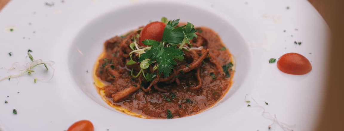Baby octopus stew "alla luciana" with toasted brad