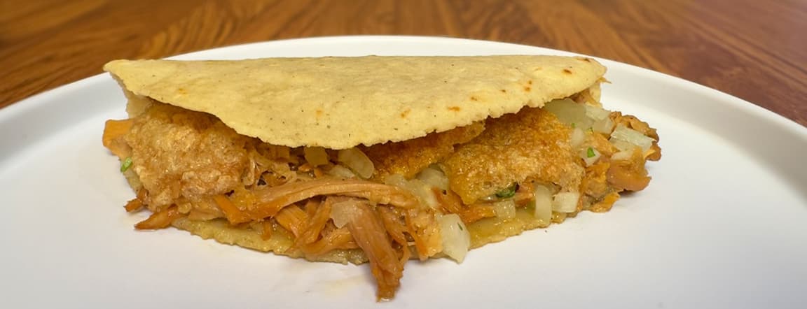 Lechón al horno / roasted suckling pig quesadilla.