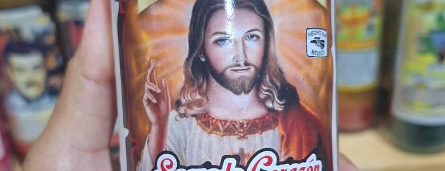 Color candle (red) with sacred heart label of jesus