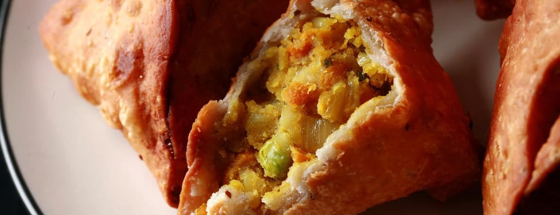 Two samosas - potato & cauliflower