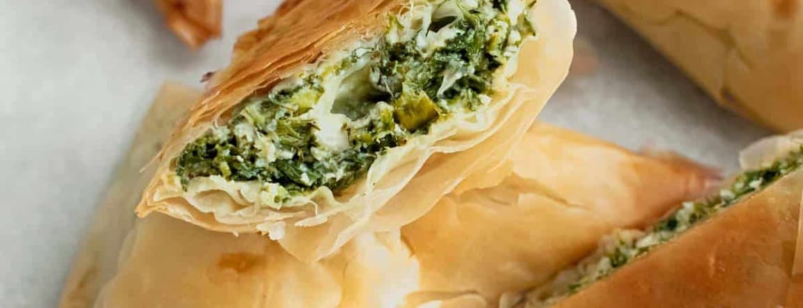 Two samosas - spinach with cheese