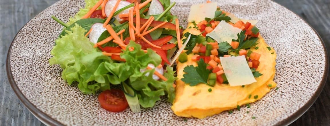 Three-cheese omelette with salad