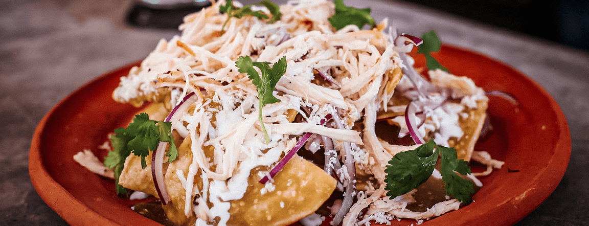 Green chilaquiles with chicken and eggs